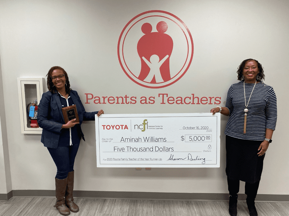 PAT Parent Educator Aminah Williams (left) and Constance Gully, president and CEO of Parents as Teachers, pose with a $5,000 ceremonial check given to Williams for placing second in the 2020 Toyota Family Teacher of the Year Award contest. The award…