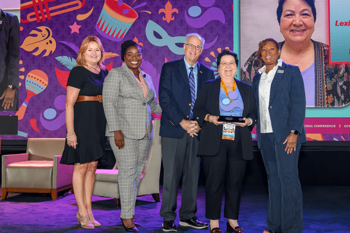 Guillermina (Gigi) Towers (second from right) receives her Parent Educator of the Year Award at the Parents as Teachers 2023 International Conference in New Orleans. From left are Parents as Teachers Board Members Susan Gibson, Dr. Jamie Singleton, Board Chair Dr. Mark Ginsberg, and President/CEO Constance Gully.