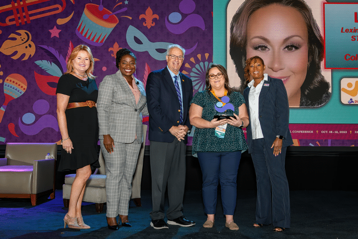Lydia Mayo (second from right) receives her Parent Educator of the Year Award at the Parents as Teachers 2023 International Conference in New Orleans. From left are Parents as Teachers Board Members Susan Gibson, Dr. Jamie Singleton, Board Chair Dr. Mark Ginsberg, and President/CEO Constance Gully.